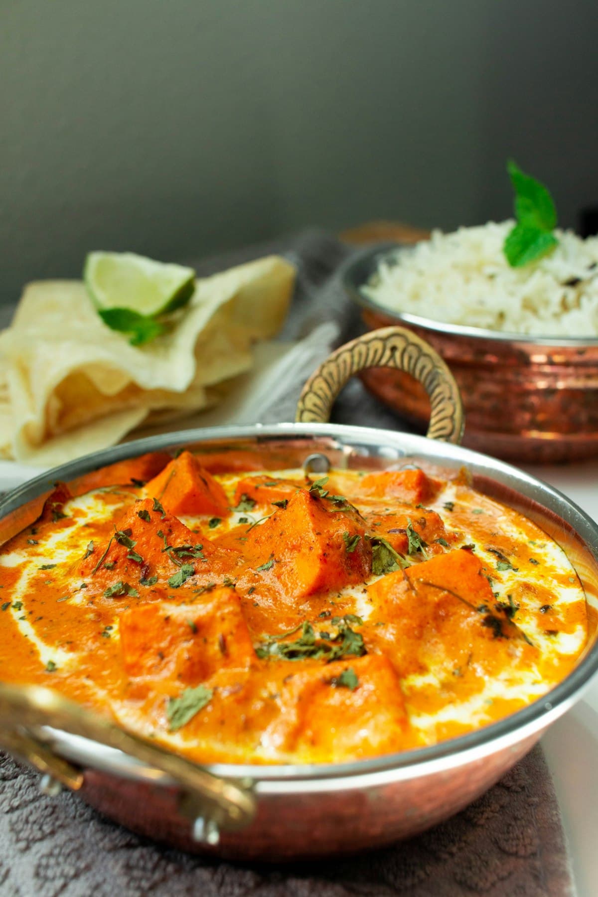 A fresh home-style Indian meal with rice, chapati, curry, salad and curd